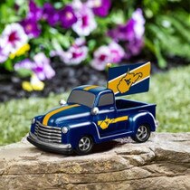 Navy and gold WVU rally truck statue with a flag in the bed of the truck