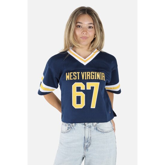 Model wearing the navy WVU cropped football jersey with West Virginia over 67 on the front