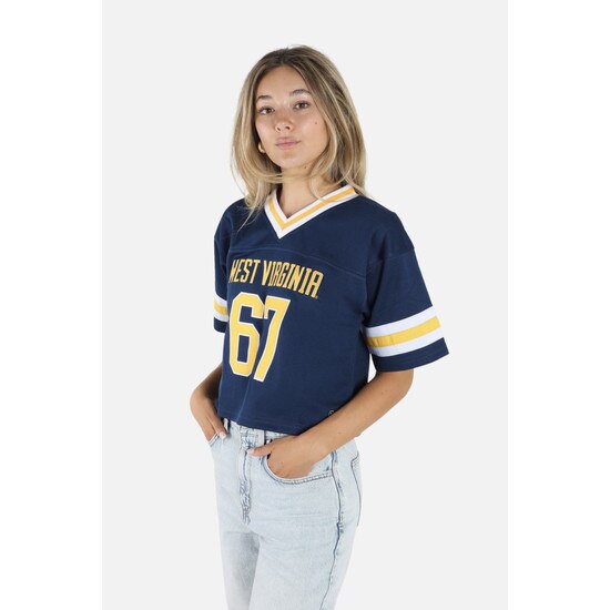 Model wearing the navy WVU cropped football jersey with West Virginia over 67 on the front