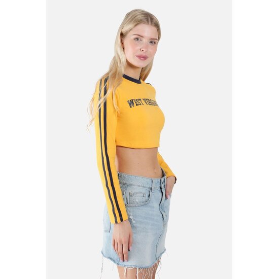 Side view of the model wearing the gold WVU cropped long sleeve tee with navy sleeve stripes and collar taping and West Virginia script in navy as the chest graphic