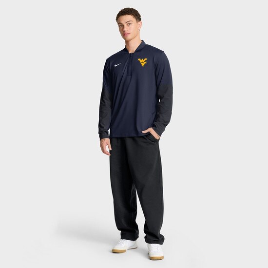 Full length view of male model wearing navy Nike WVU quarter zip pullover