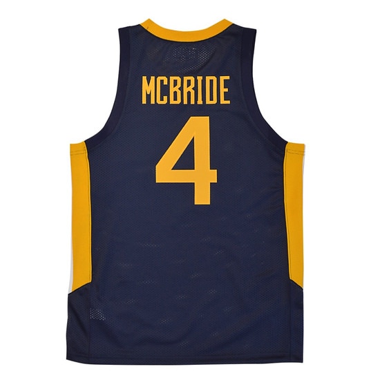 Flat lay of the back of the navy WVU #4 Deuce McBride basketball jersey with McBride over a number 4 on the back