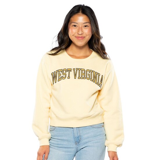Model wearing the butter WVU cropped crew with an arched West Virginia as the front graphic